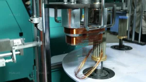 machine.jpg High-speed automated copper wire winding for submersible pump motor cores.