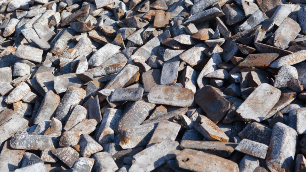 Raw cast iron pieces used for casting 8 inch borehole pump components.