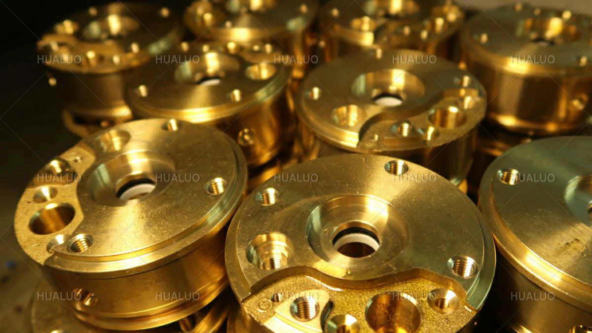 Precision-machined brass components for fountain pump heads and valve bodies.