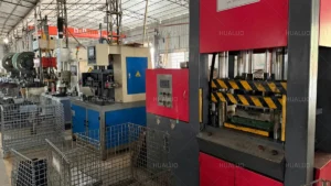 Press machines making parts for industrial water pumps in a manufacturing workshop.